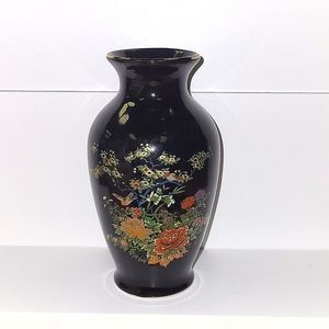 Antique painted vase with Chinese writing on bottom